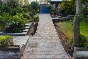 Award winning driveway, patio, walling and landscaping installed by Stow Construction & Landscaping in Ravelston, Edinburgh 2012 using Marshalls Tegula Drivesett Pennant Grey including circle feature, Marshalls Indian Sandstone paving, Grey Multi, Fairstone walling, Silver Birch.
