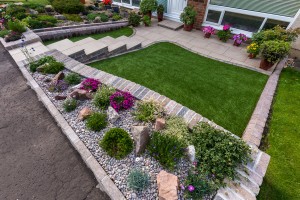 Patio, steps, walling and Namgrass by Stow Construction & Landscaping 2017 using Marshalls Symphony Vitrified paving Buff, Marshalls Tegula walling Traditional, Tegula kerbs Traditional, Namgrass & Scottish pebbles