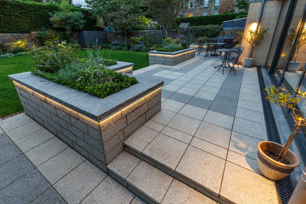 Patio, walling and steps by Stow Construction & Landscaping in Nile Grove, Edinburgh 2017 using Marshalls Argent walling Light, Argent Light & Dark Smooth, Argent coping dark. Garden lighting.