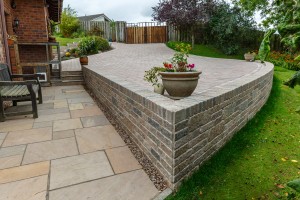 Driveway, garden design, path, walling, steps and turfing by Stow Construction & Landscaping in Penicuik 2017 using Marshalls Fairstone Riven Harena Autumn Bronze Multi, Drivesett walling Traditional, Tegula drivesett Traditional, turf and decorative gravel.